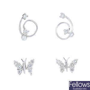 Two pairs of 18ct gold diamond earrings.