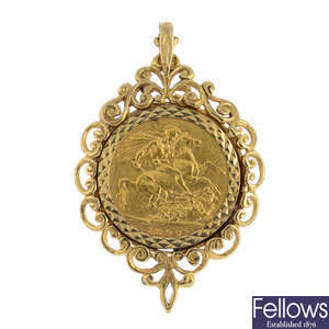 A sovereign coin pendant.