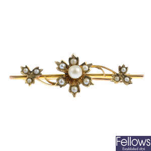 An early 20th century split pearl and cultured pearl brooch and a 9ct gold necklace.