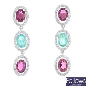 A pair of tourmaline and emerald earrings.