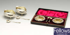 A pair of late Victorian silver open salts with spoons & a cased pair of Edwardian silver open salts with matched spoons.