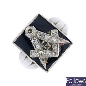 A mid 20th century platinum diamond and enamel Masonic ring.