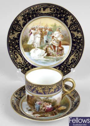 A Royal Vienna porcelain tea cup, saucer and side plate.