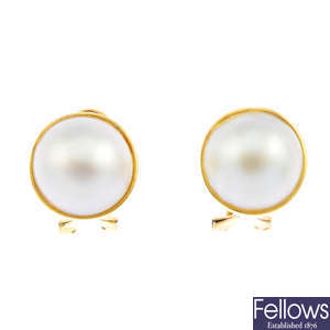A pair of 9ct gold mabe pearl earrings.