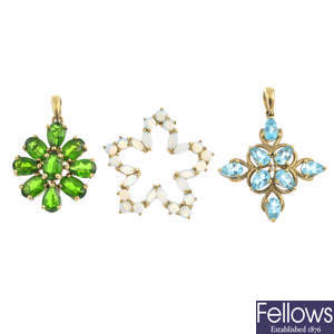 Five gem-set pendants.