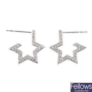 TADA & TOY - a pair of diamond star earrings.