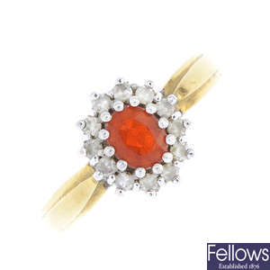 An 18ct gold fire opal and diamond cluster ring.