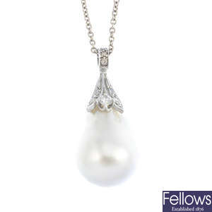 A baroque pearl and diamond pendant, with a chain.