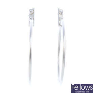 LOUIS VUITTON - a pair of diamond 'Creoles Clous' hoop earrings.