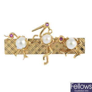 A cultured pearl and ruby brooch.