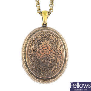 A late Victorian locket, with chain.