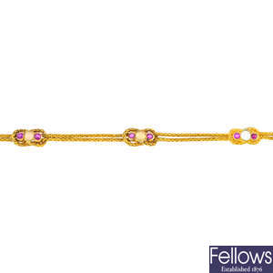 An early Victorian gold ruby and opal bracelet.