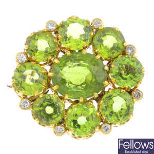 An early 20th century gold, peridot and diamond cluster brooch.
