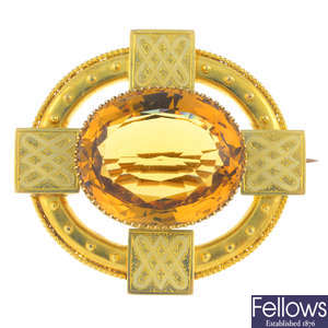 A late Victorian citrine and enamel brooch.