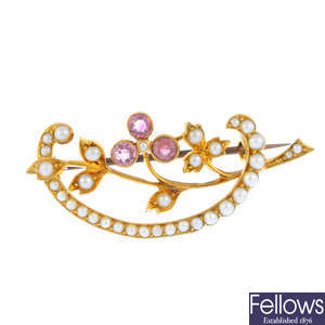 An early 20th century 15ct gold, pink sapphire and split pearl floral brooch