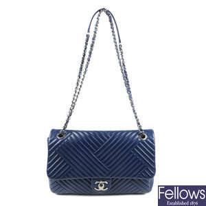 CHANEL - a blue chevron quilted Single Flap handbag.