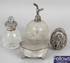 A Birmingham 1914 hallmarked silver trinket box, two hallmarked silver topped cut glass dressing table jars, similar scent bottle trinkets, etc.