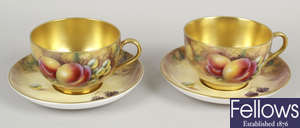 A pair of large Royal Worcester bone china cups and saucers.
