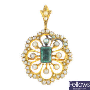 An early 20th century gold emerald and split pearl pendant.