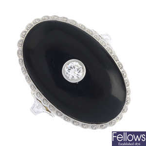 A diamond and onyx ring.