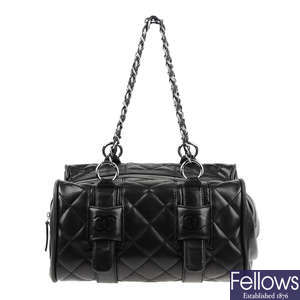 CHANEL - a small quilted duffle bag.