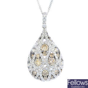 An 18ct gold diamond and 'brown' diamond pendant, with chain.