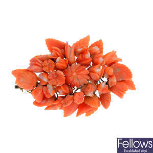 A carved coral brooch.