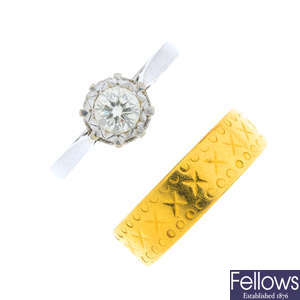 A mid 20th century 22ct gold band ring and a diamond single-stone ring.