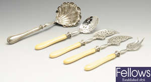 A continental spoon, plus four ivory handled servers. (5).
