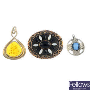 A selection of gem-set brooches and pendants.