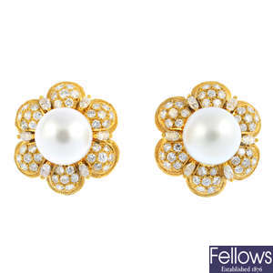 A pair of cultured pearl and diamond floral cluster earrings.