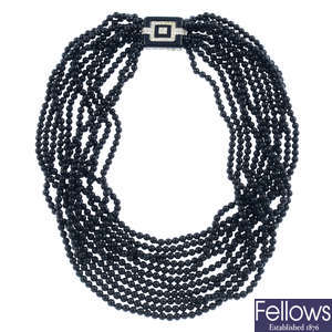 An onyx multi-strand necklace, with diamond and onyx clasp.