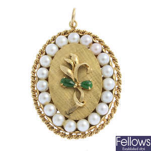A jade and cultured pearl pendant.