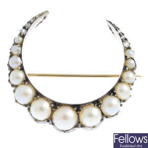 A late Victorian silver and gold, split pearl and diamond crescent brooch.