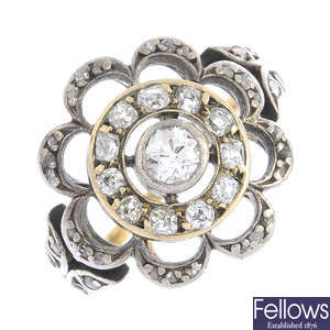 An Edwardian silver and gold diamond floral cluster ring.