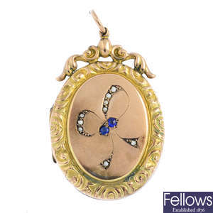 An early 20th century 9ct gold back and front split pearl and garnet-topped-doublet locket.