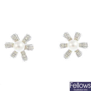 A pair of cultured freshwater pearl and diamond earrings.