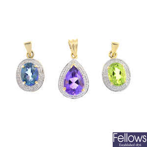 Eleven diamond and gem-set pendants.