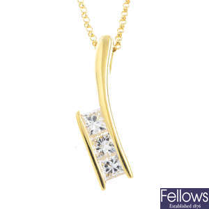 An 18ct gold diamond three-stone pendant, with chain.