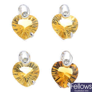 Four 18ct gold citrine and diamond pendants.