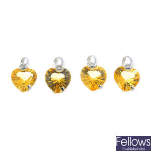Four 18ct gold citrine and diamond heart-shape pendants.