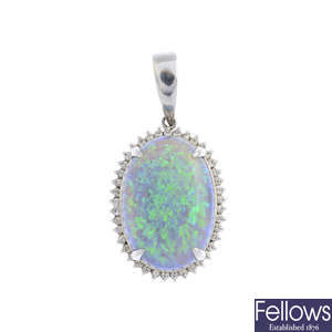 An opal and diamond cluster pendant.