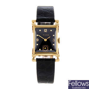 BULOVA - a lady's yellow metal wrist watch.
