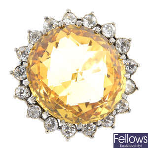 A golden topaz and diamond cluster ring.