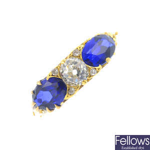 An 18ct gold synthetic sapphire and diamond three-stone ring.