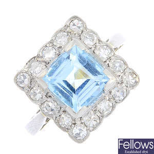 A mid 20th century aquamarine and diamond cluster ring.