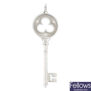 TIFFANY & CO. - a diamond 'Clover Key' pendant.
