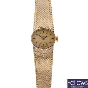 OMEGA - a lady's 9ct yellow gold De Ville bracelet watch.