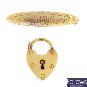 An early 20th century 9ct gold brooch and a 14ct gold heart-shape lock clasp.