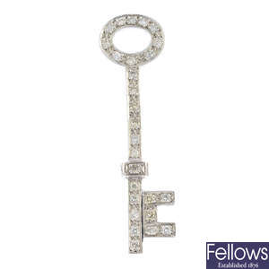 A diamond key pendant.